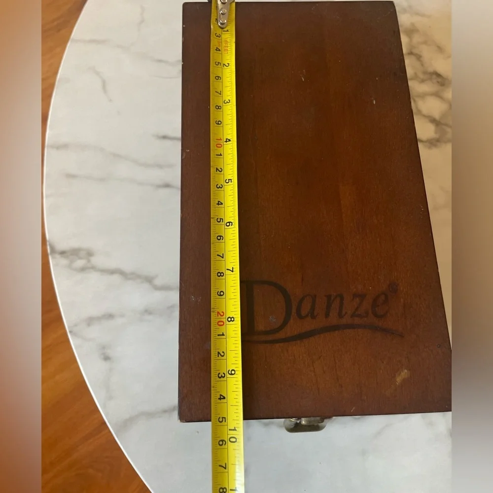 Wooden box for displaying coins with the name marked Danze logo